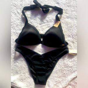Pink black bikini. Top has adjustable clasp. Size large